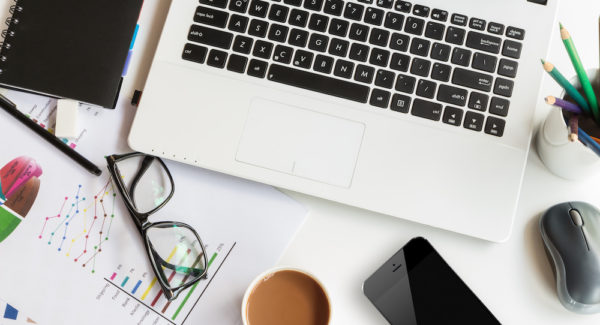 work table with laptop computer top view